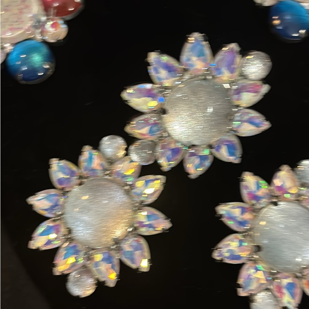 Elegant Silver and Iridescent Flower Earrings and ring
